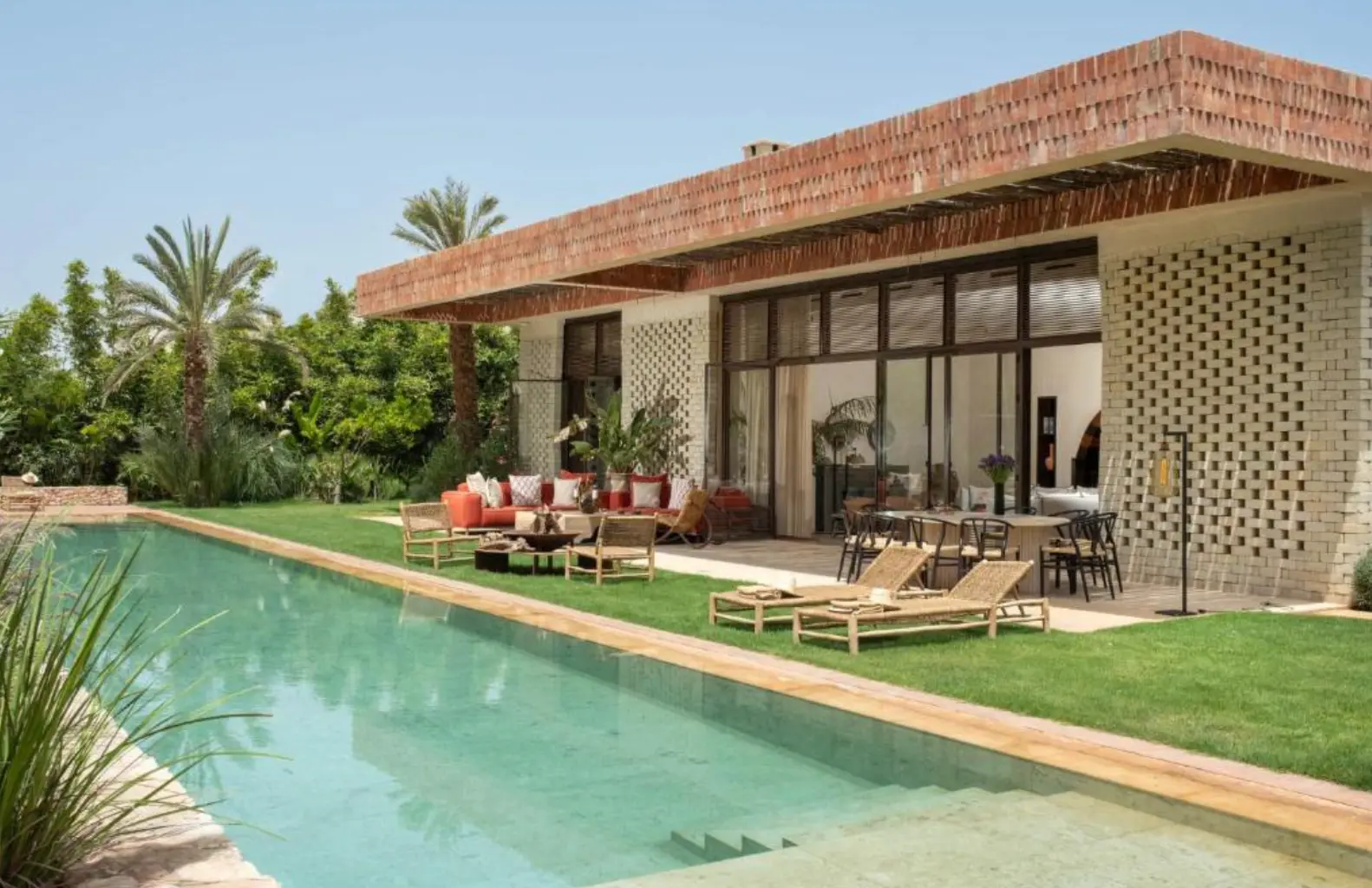 Villa Sama and its pool among the palm groves of Marrakech